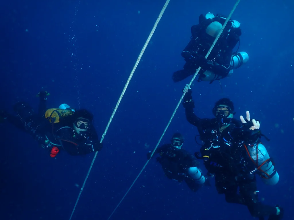 a group of scuba divers in the water